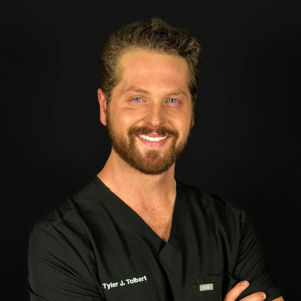 Dr. Tyler Tolbert DMD FICOI | Dentist at Smile Now Milwaukee Dentures and Implants in Milwaukee, WI